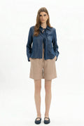 White Bermuda Shorts by MYT, showing the full length shorts with a relaxed fit and clean design on a plain background.