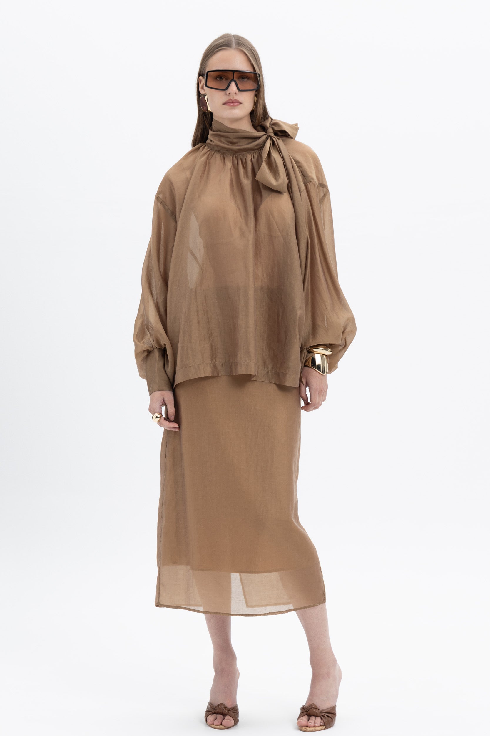Sheer organza blouse from MYT featuring a lightweight, flowy fabric with a delicate, transparent design and stylish collar...