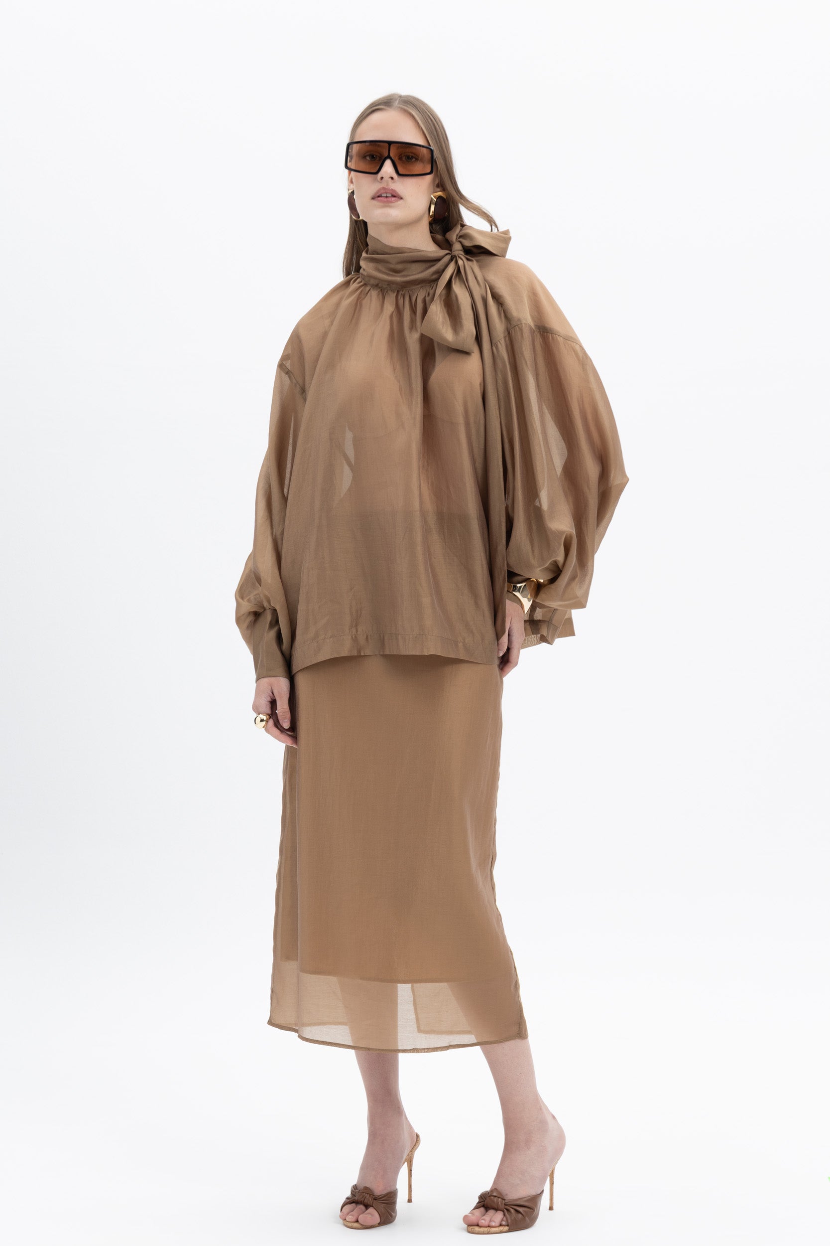 Elegant sheer organza blouse by MYT featuring lightweight, translucent fabric with a stylish, flowy design, perfect for so...