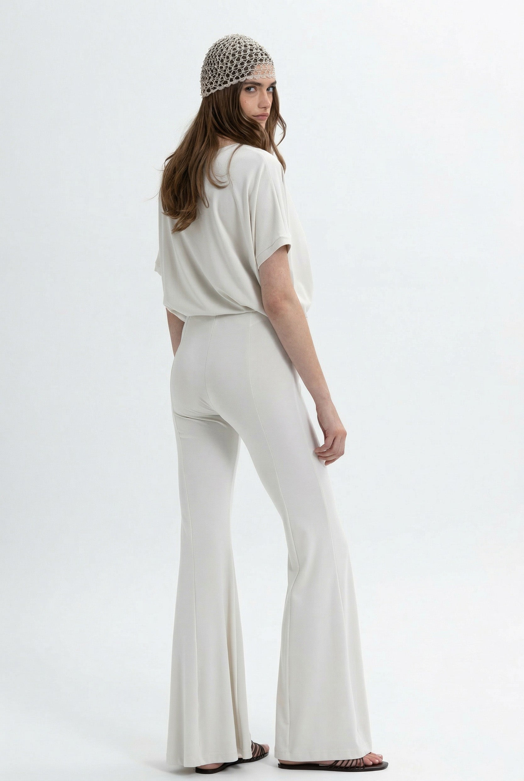 MYT flared pants in bright yellow with oversized fit, casual style, and high-waisted design, shown from front and side views.