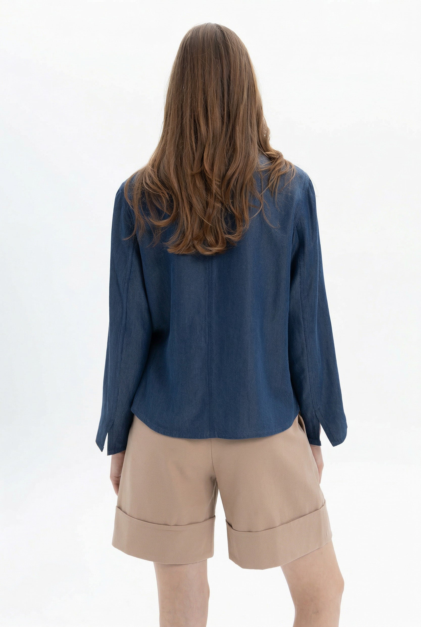 White MYT Bermuda shorts shown on a hanger, highlighting the casual style and clean design of these summer shorts.