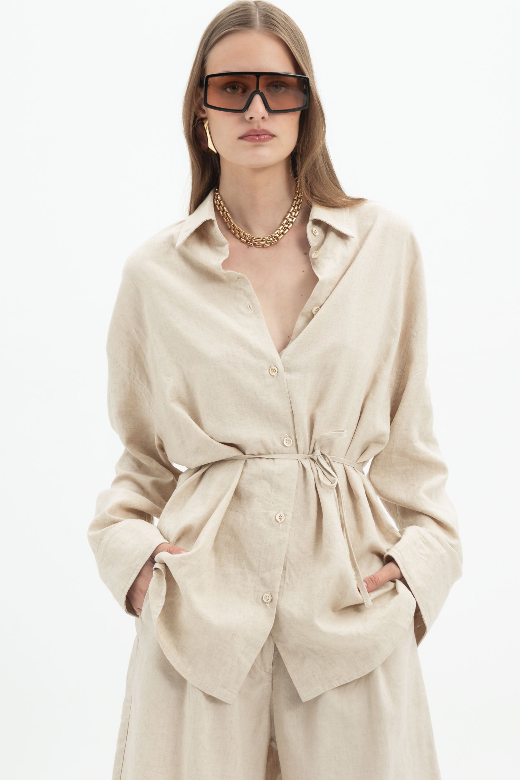 Sand beige linen long sleeve belted shirt from MYT, styled with matching shorts, casual and comfortable for women.