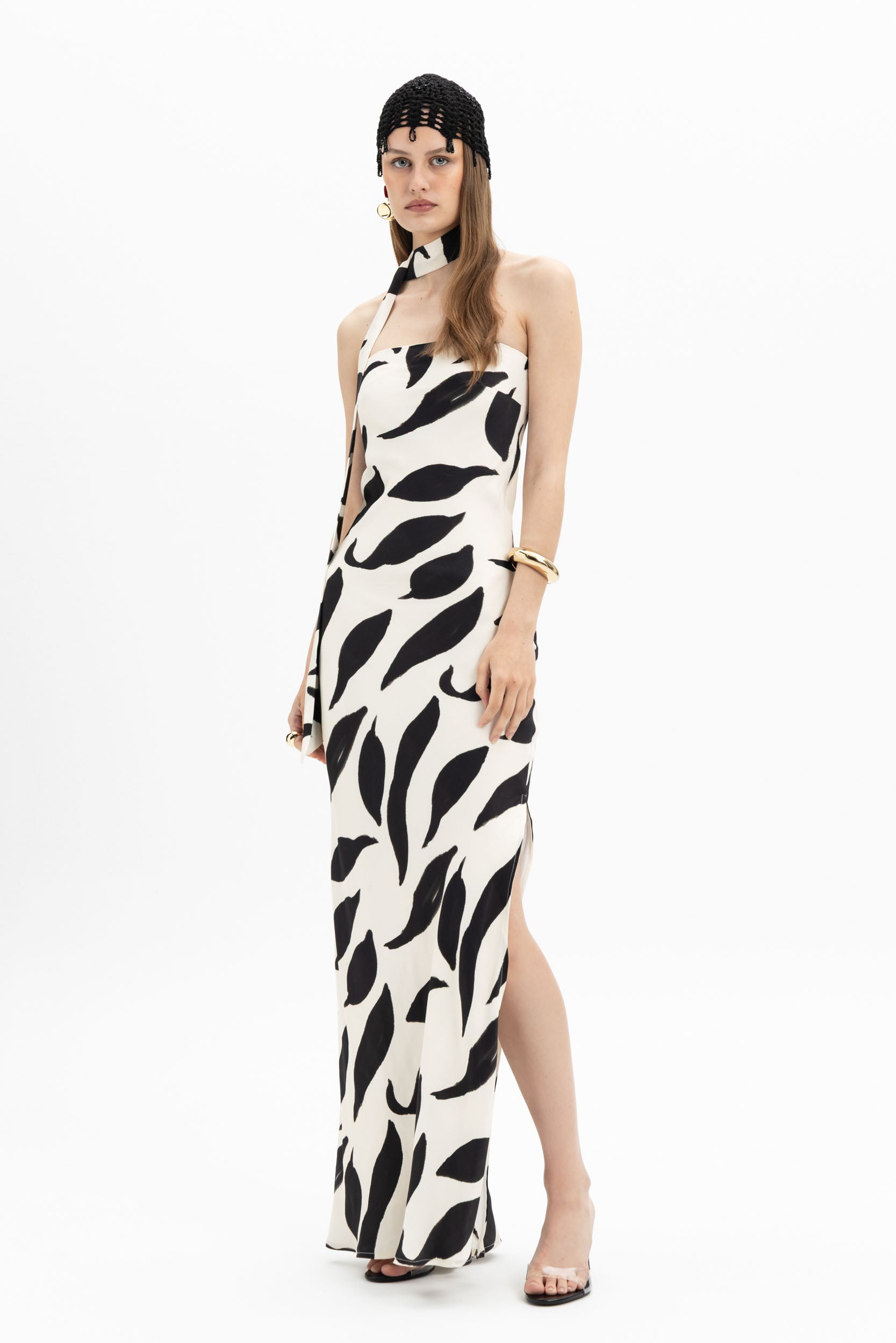 MYT abstract black and white halter maxi dress with a flowing silhouette and bold print, perfect for elegant summer wear.
