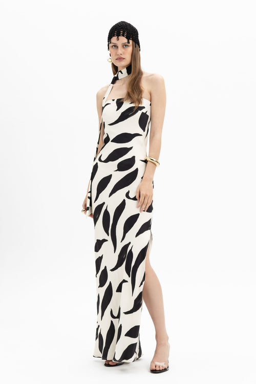 MYT abstract black and white halter maxi dress with a flowing silhouette and bold print, perfect for elegant summer wear.