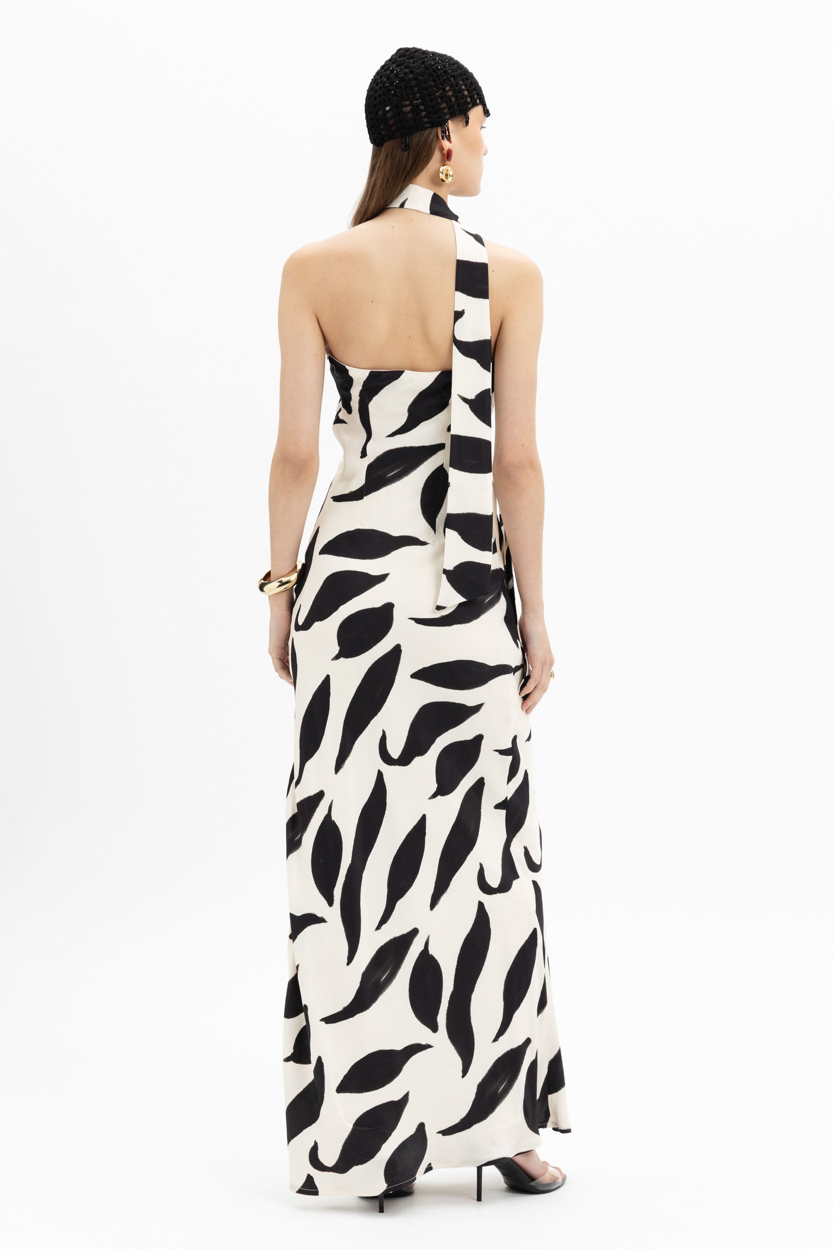 White and black abstract print halter neck maxi dress by MYT, flowing maxi dress with stylish halter design for women.
