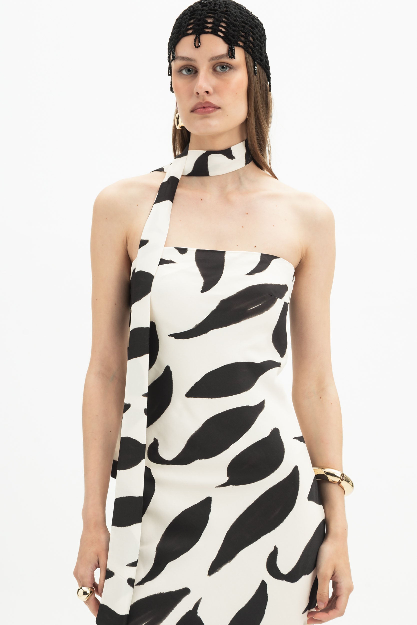 MYT Abstract Halter Maxi Dress in white and black with bold abstract print, sleeveless halter neck, flowing maxi length for women.