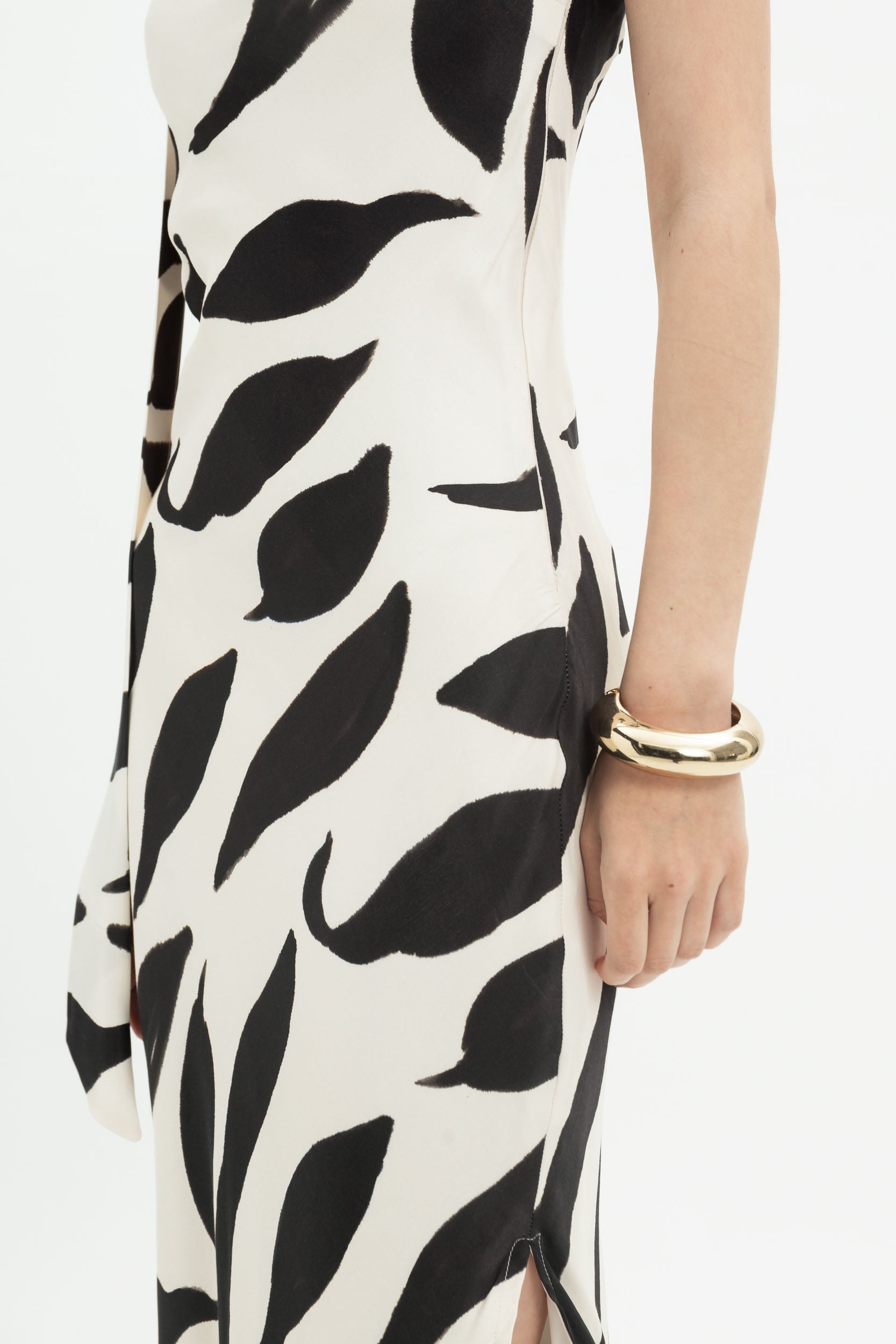 White and black abstract print MYT halter maxi dress on a woman, flowing design with a halter neckline and elegant style.