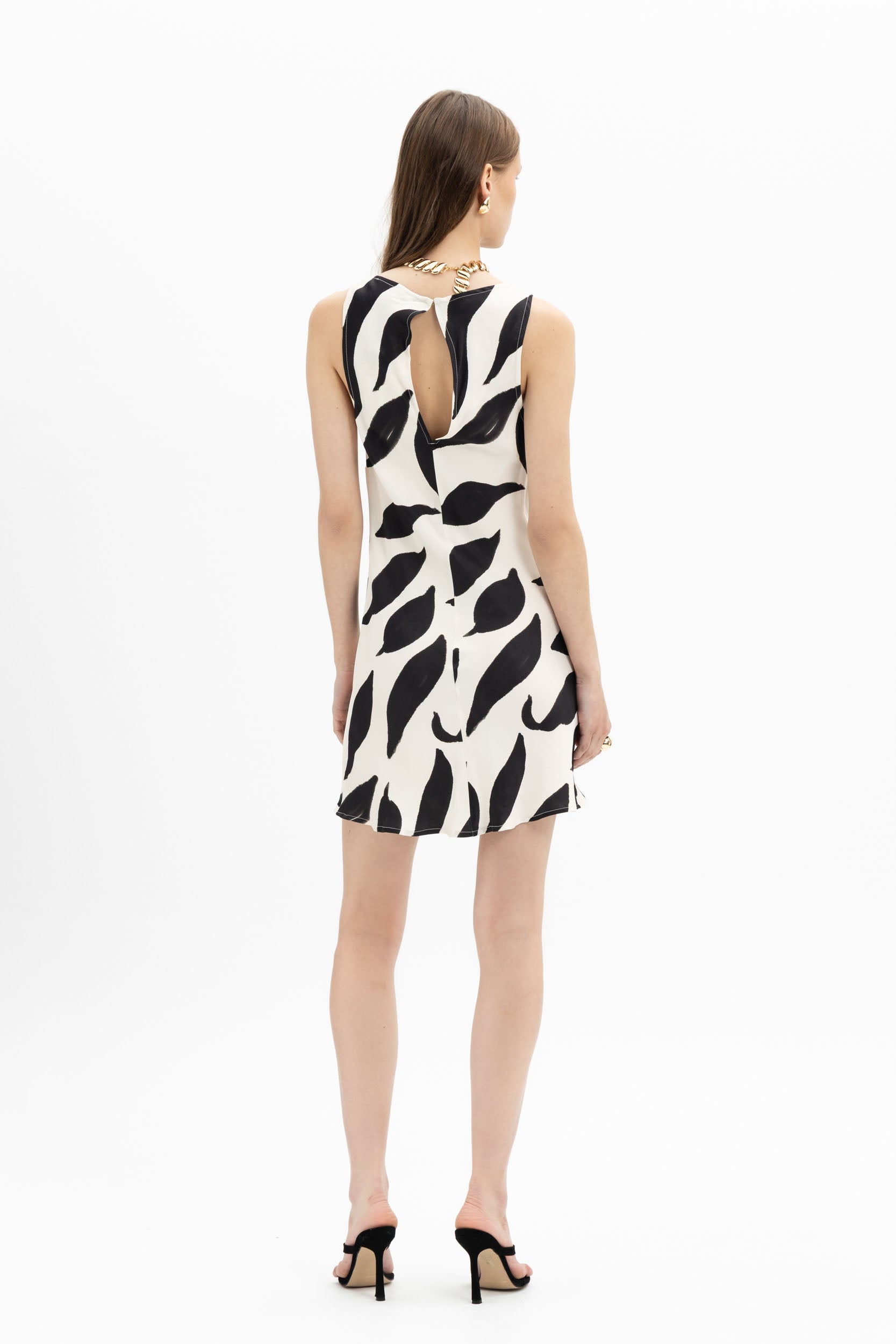 White and black Brushstroke Mini Dress by MYT featuring sleeveless design and artistic brushstroke print for women.